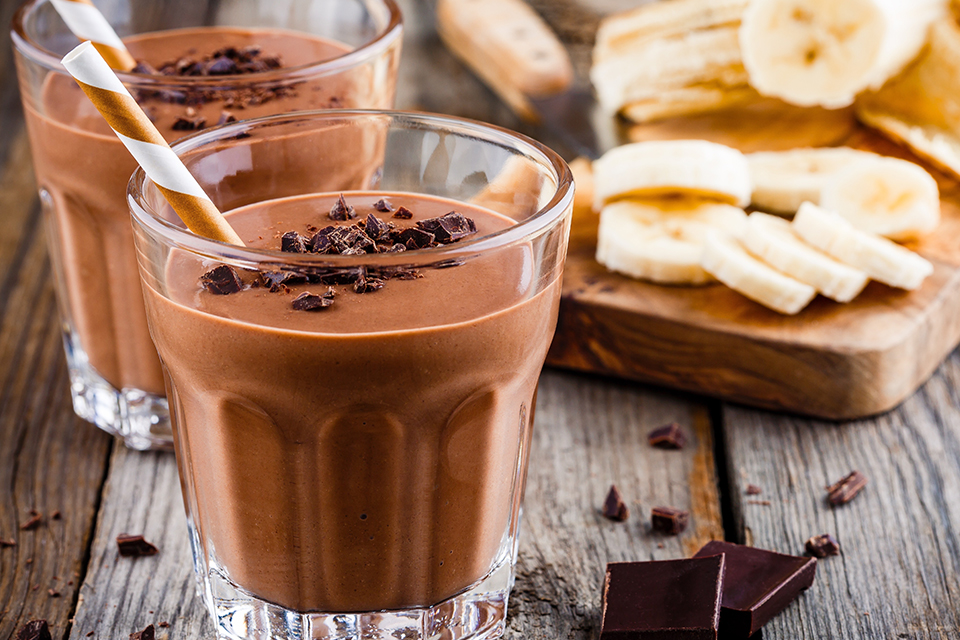 Two cups filled with Chocolate Protein Shake