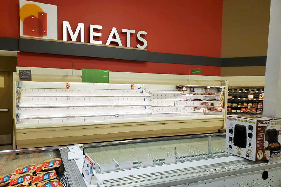 Empty meat section in a grocery store