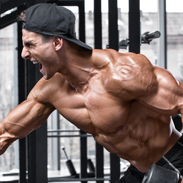Man screaming as he lifts up a dumbbell