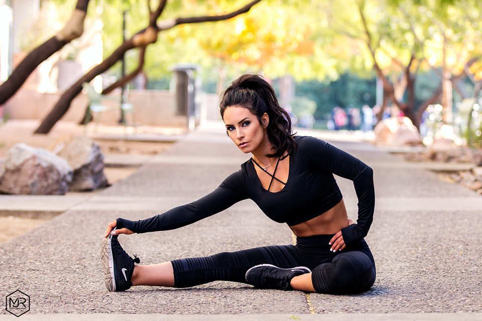 Leah Ward stretching in the park