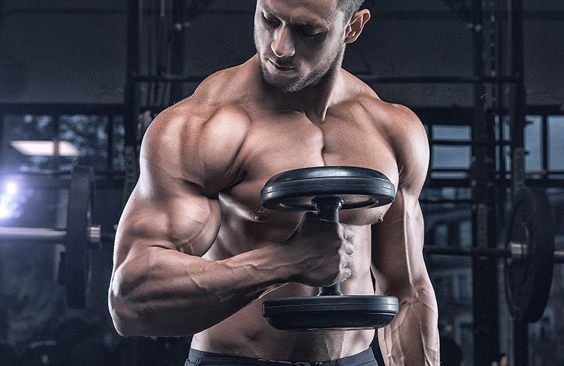 Image of man curling dumbbell