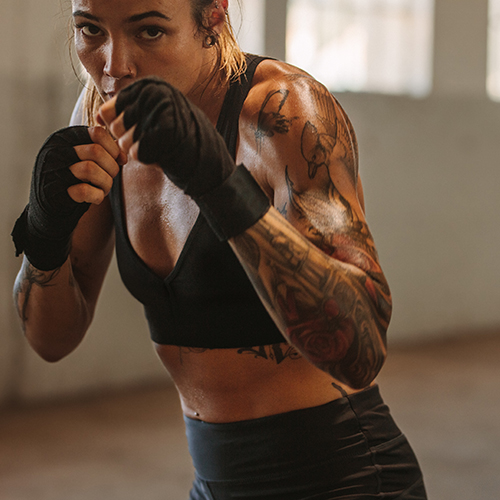 Woman in defensive boxing position