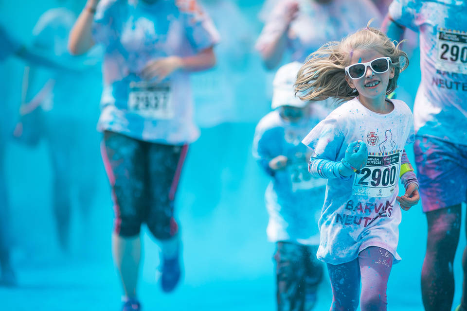 people doing a color run covered in blue 