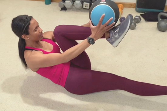 Medicine Ball Overhead Reach to ISO Knee Tuck Toe Taps form