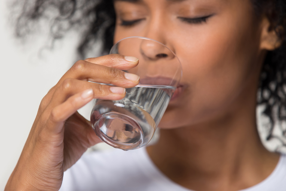 Woman drinking a glass of water