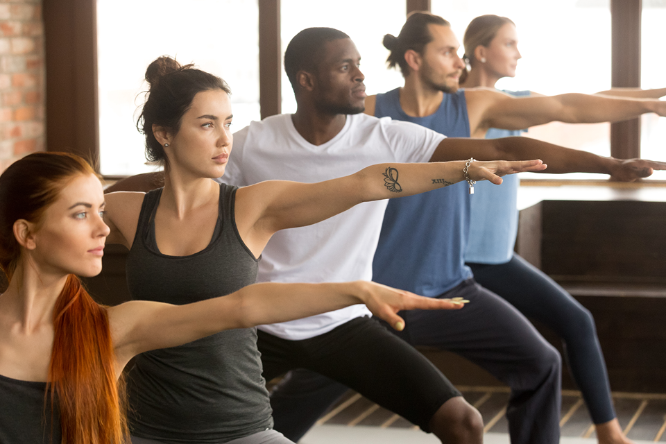 People exercising in a yoga class