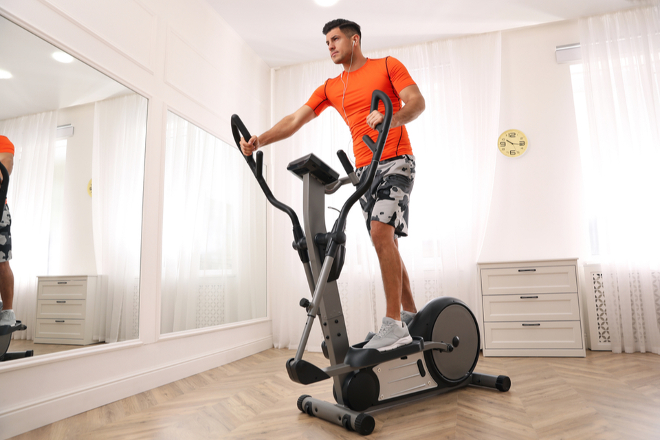 Man on elliptical machine