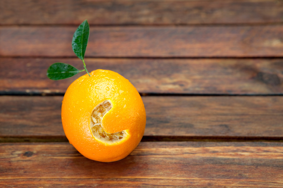 An orange with the letter C carved into it