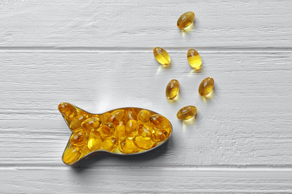 Omega 3 capsules shaped like a fish