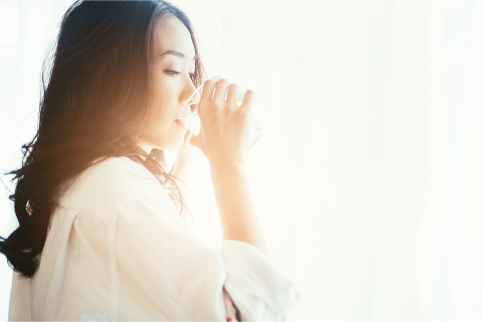 Woman drinking a glass of water