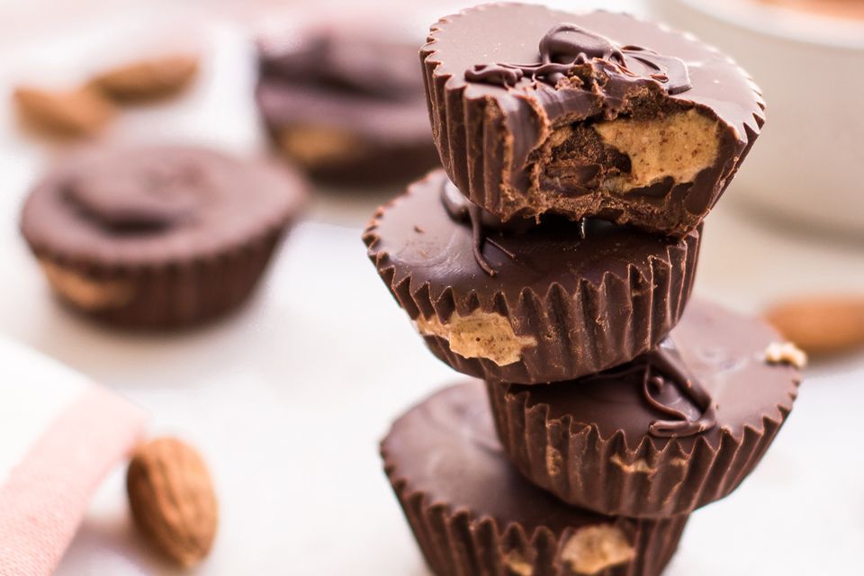 chocolate almond butter cups stacked on each other