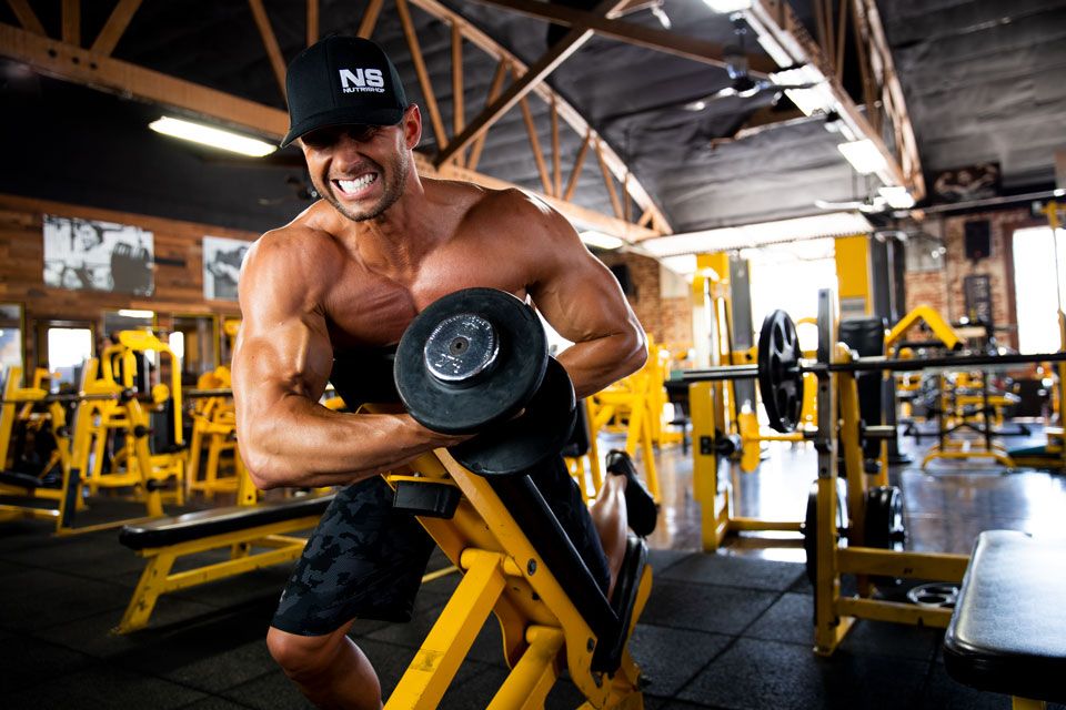 Matus Valent doing an intense bicep curl 