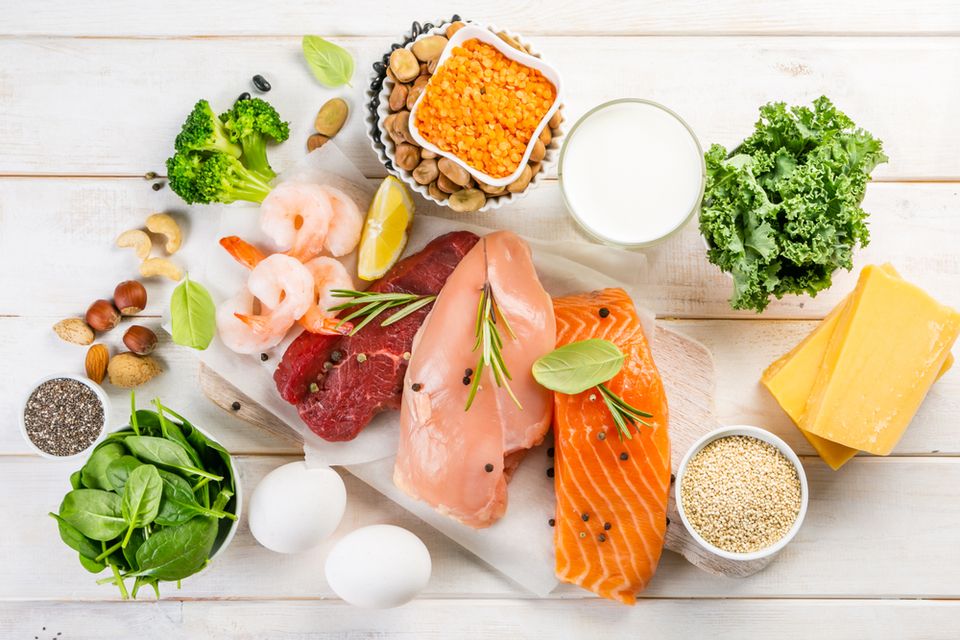 Overhead view of various foods , fish, nuts, vegetables and more