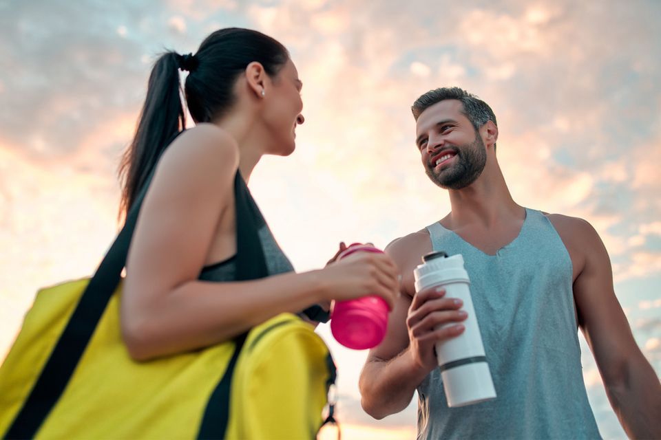 smiling couple in gym attire