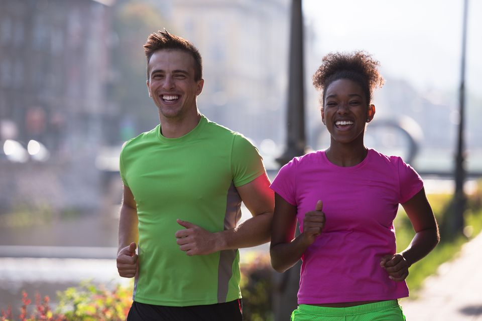 Couple happily running together